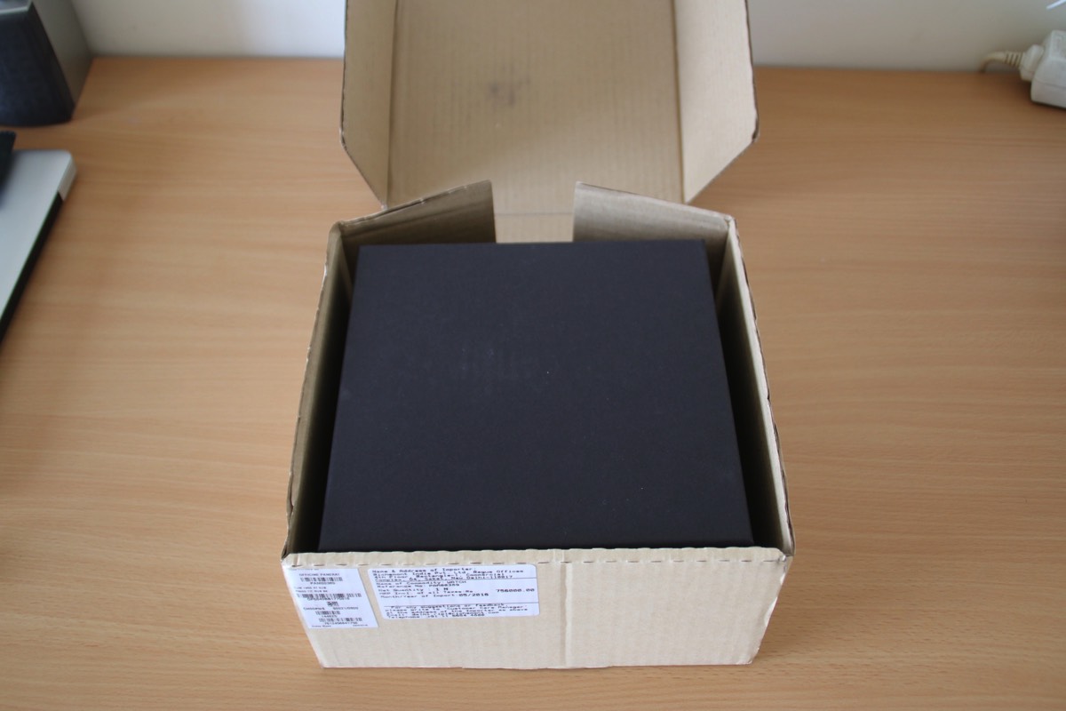 Inside the outer box, the black box